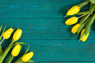 Bouquet of tulips on wooden background