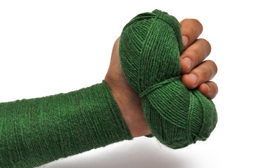 Man's hand and  green yarn isolated on a white background.Crochet.