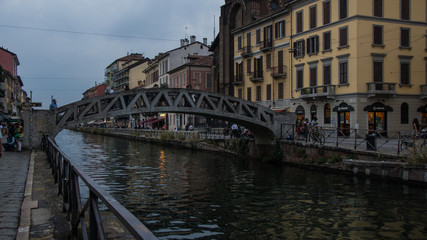 Fototapeta na wymiar iron pedestrian bridge across river