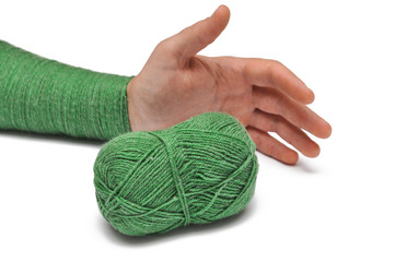 Man's hand and  green yarn isolated on a white background.Crochet.
