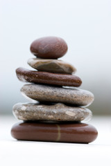 Fototapeta na wymiar Stack of wet river stones in a balance