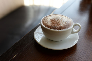 delicious hot cappuccino hot coffee in a white cup