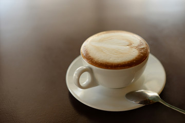 delicious hot cappuccino hot coffee in a white cup