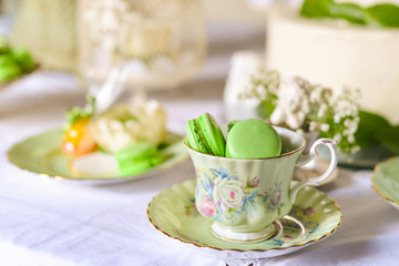 macarons in green pocelana cup, green porcelain cup, vintage cup, green macarons, 