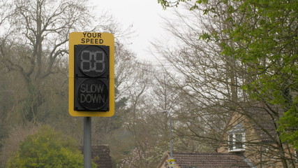 speed indicator display activated by vehicles passing and flashing your speed slow down