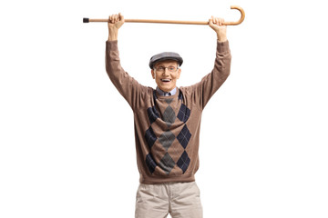 Happy senior man holding a walking cane up