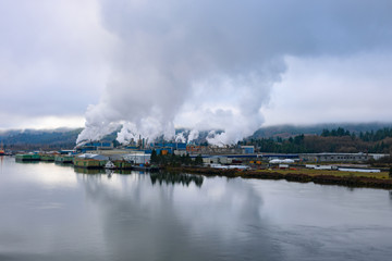 Factory at beautiful Columbia river bank, Washington and Oregon in calm weather