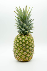 Fototapeta premium single standing fat and juicy pineapple on an isolated white background