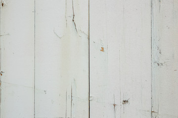 Texture of white painted wooden old fence boards