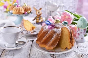 easter ring cake with  powdered sugar on festive table