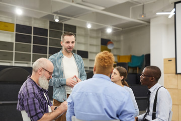 Portrait of mature man    giving speech during therapy session in support group, copy space