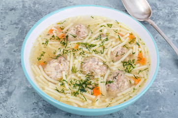 Delicious broth with meatballs and pasta.