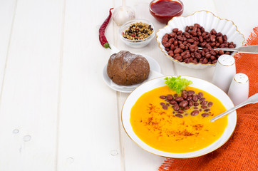 Vegetable vegetarian carrot pumpkin soup cream with red beans
