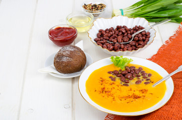 Vegetable vegetarian carrot pumpkin soup cream with red beans