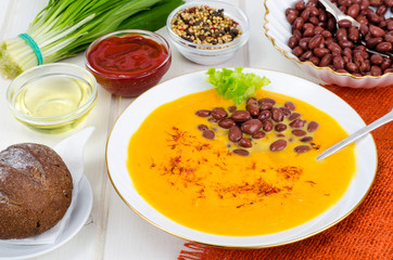 Vegetable vegetarian carrot pumpkin soup cream with red beans