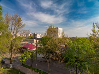 City landscape at summer day with blue sky