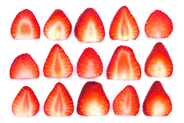 Plate of sliced strawberries isolated on white background. Strawberry berry on a white background. Neatly arranged slices of red strawberry on a white background.