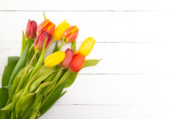  Arrangement of Beautiful Spring Tulips on a White Wood Table