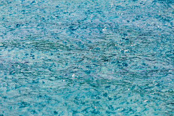 Hotel swimming pool with raining