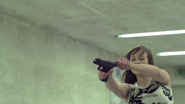 Slow Motion - Young Girl Running Aiming Gun