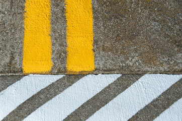 Double yellow line abuts white hatched lines.  A metaphor for “Two points of view”