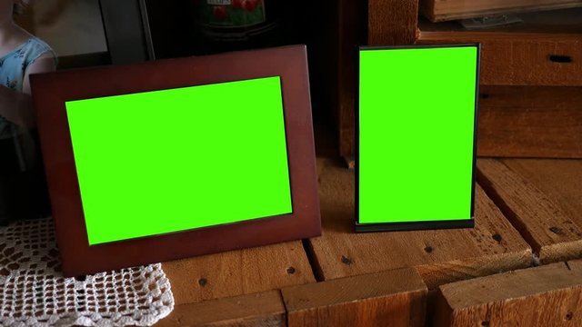 A pair of green screen picture frames