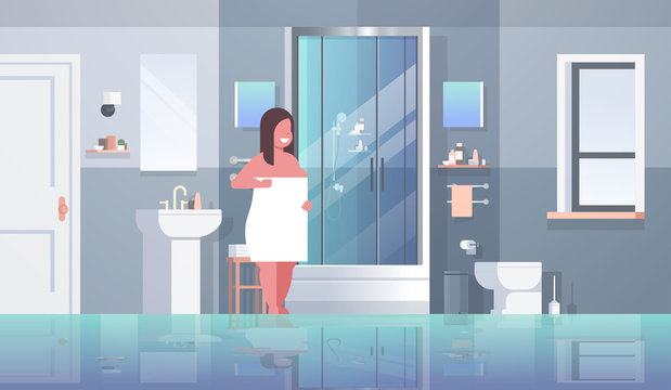 fat obese woman wrapped with white towel overweight girl standing in bathroom after shower obesity concept modern apartment interior horizontal full length