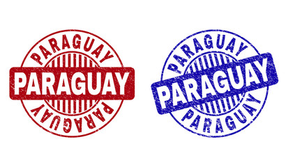 Grunge PARAGUAY round stamp seals isolated on a white background. Round seals with grunge texture in red and blue colors. Vector rubber imprint of PARAGUAY caption inside circle form with stripes.