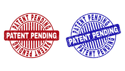 Grunge PATENT PENDING round stamp seals isolated on a white background. Round seals with grunge texture in red and blue colors.