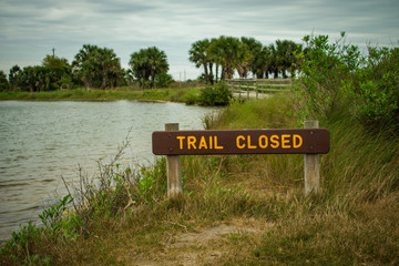 Trail Closed Sign On A Lake Trail