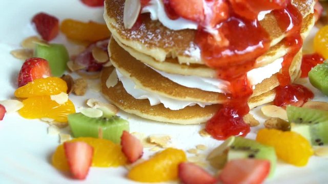 Close up of mix fruits pancake with jam