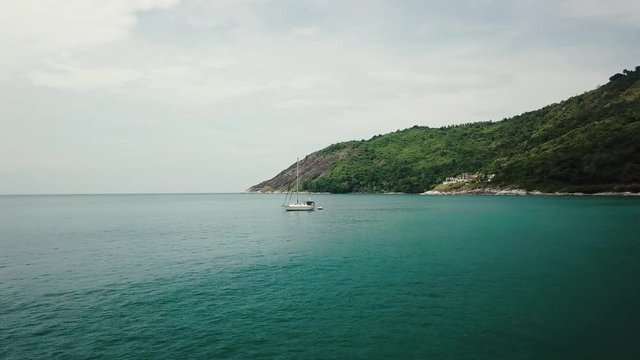 AERIAL: Flying over the ocean to sail boat, Thailand