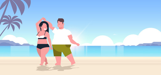 fat obese couple wearing beach clothes overweight man woman dancing having fun summer vacation concept beautiful seaside sunset landscape background full length flat horizontal