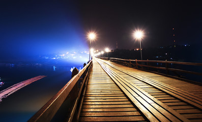 Fototapeta na wymiar wooden bridge at night,Sangklaburi,Kanchanaburi province, Thailand