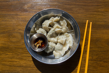 Chinese chive and pork dumplings with chili black vinegar sauce.