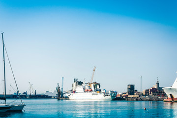 Naklejka premium The Catania Port Authority, seascape with sail boats, Sicily, Italy.