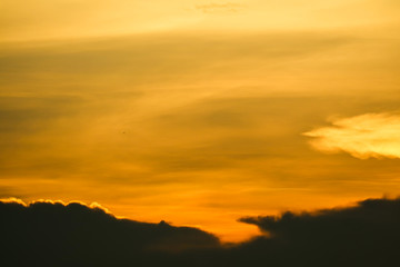 Fototapeta na wymiar multicolor heap giant orange sunset cloud and dark sky