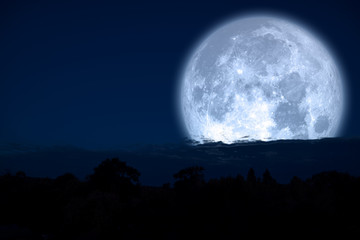 Fototapeta na wymiar super milk moon back on silhouette mountain on night sky