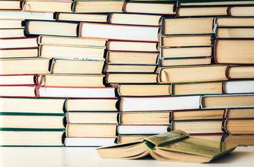 Books background, open book on white wooden table in office for education learning concept.