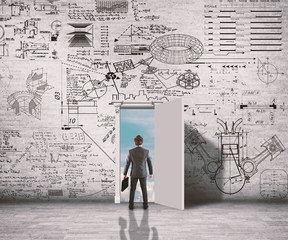 businessman drawing graph on brick wall