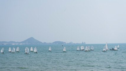 many small boat and blue water ocean