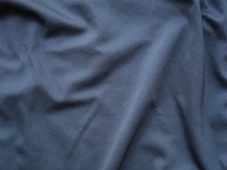 Fototapeta na wymiar black sportswear shirt background,silk shirt texture