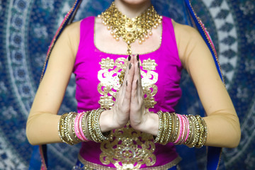 Portrait of a female model in ethnic indian costume with  jewellery and traditional makeup.