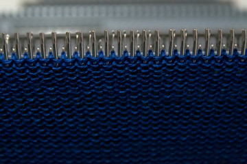 Manual knitting machine. A knitting machine is a device used to create knitted fabrics