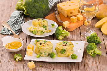 Potato gratins with broccoli florets.