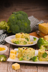 Potato gratins with broccoli florets.