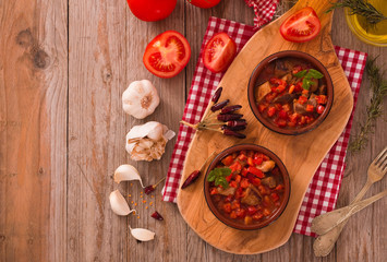 Marinated pork loin in tomato sauce.