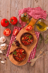 Marinated pork loin in tomato sauce.