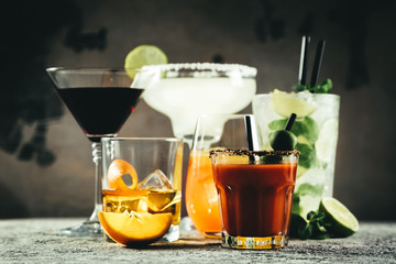 Selection of classic cocktails - cosmopolitan, mojito, bloody mary, old fashioned, margarita, aperol