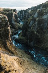 Scenery of cliffs with mountains stream in Nordic landscape of Iceland